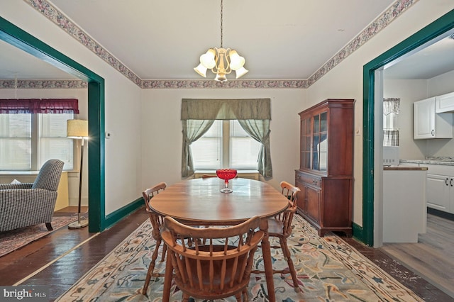 135 Pine St, Dover, DE 19901 - dining space with healthy amount of natural light, hardwood / wood-style floors, and a chandelier