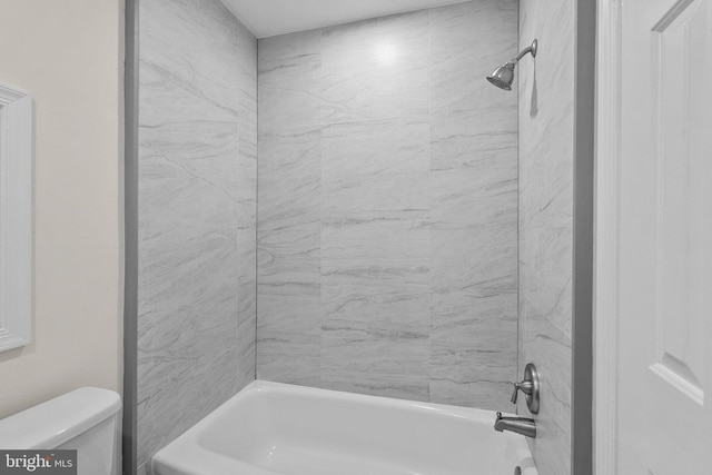 bathroom featuring toilet and shower / washtub combination