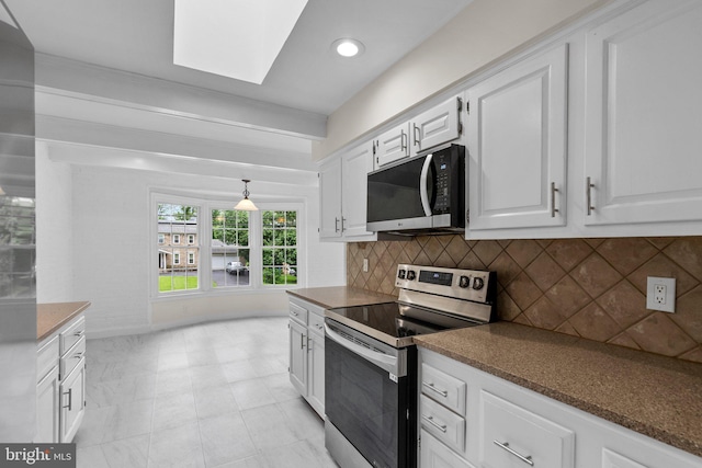 kitchen with electric range, backsplash, white cabinetry, a skylight, and dark countertops