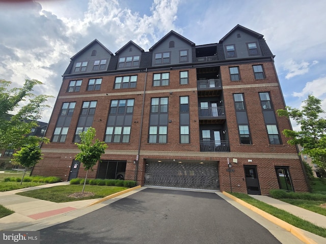 3927 Fair Ridge Dr Unit 305, Fairfax, VA 22033 - view of property with an attached garage and driveway