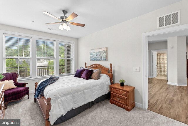 3927 Fair Ridge Dr Unit 305, Fairfax, VA 22033 - bedroom with baseboards, ceiling fan, and light carpet