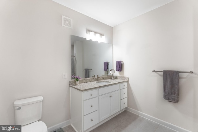 3927 Fair Ridge Dr Unit 305, Fairfax, VA 22033 - bathroom with baseboards, toilet, vanity, and tile patterned flooring