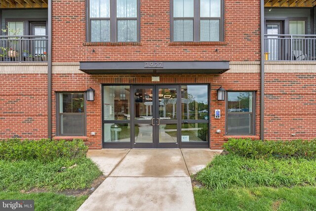 3927 Fair Ridge Dr Unit 305, Fairfax, VA 22033 - view of exterior entry with french doors and brick siding