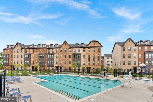 3927 Fair Ridge Dr Unit 305, Fairfax, VA 22033 - community pool featuring fence and a patio