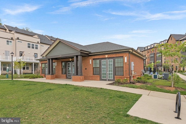 3927 Fair Ridge Dr Unit 305, Fairfax, VA 22033 - back of property with brick siding, a yard, a patio area, and central AC unit