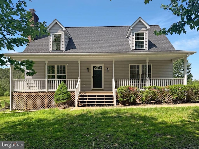 4152 Windy Hills Ln, King George, VA 22485 - view of front facade with a porch, a front yard, a shingled roof, and a chimney