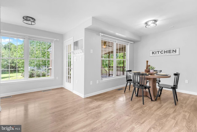 4152 Windy Hills Ln, King George, VA 22485 - dining room featuring light wood-type flooring, baseboards, and healthy amount of natural light