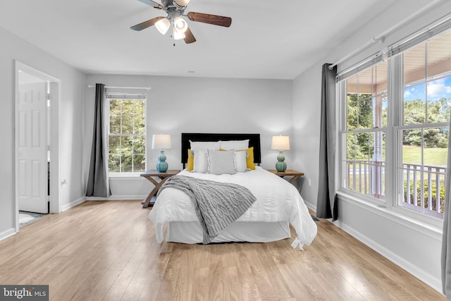 4152 Windy Hills Ln, King George, VA 22485 - bedroom featuring multiple windows, baseboards, and light wood-type flooring