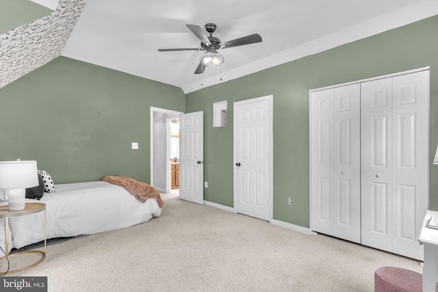 4152 Windy Hills Ln, King George, VA 22485 - carpeted bedroom featuring vaulted ceiling, baseboards, ceiling fan, and two closets