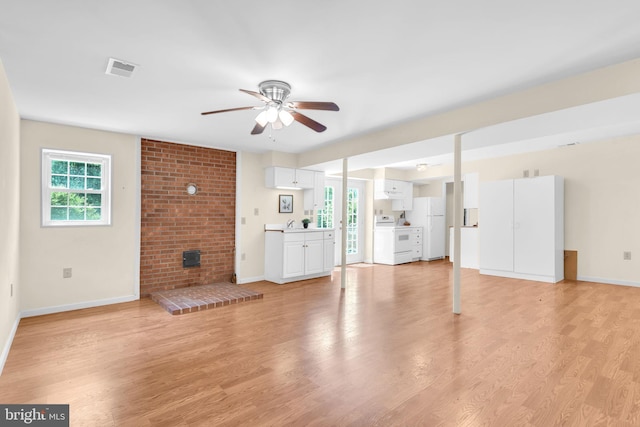4152 Windy Hills Ln, King George, VA 22485 - unfurnished living room with a ceiling fan, baseboards, light wood finished floors, and a fireplace