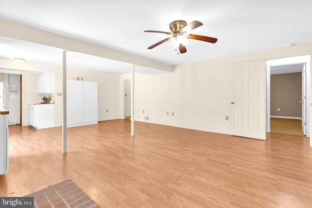 4152 Windy Hills Ln, King George, VA 22485 - below grade area with ceiling fan, light wood-style flooring, and arched walkways