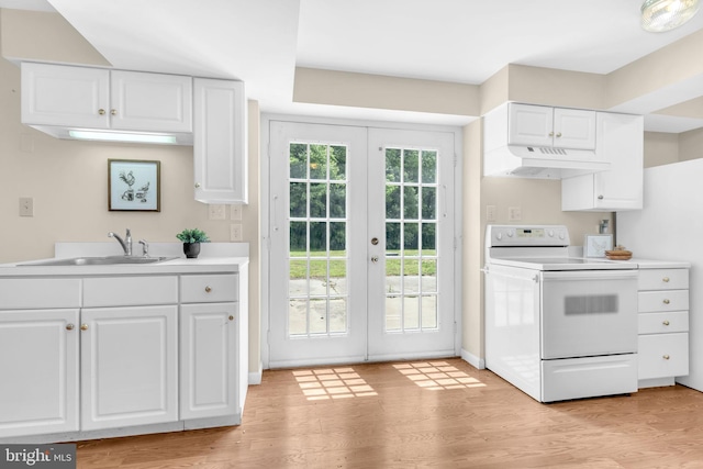 4152 Windy Hills Ln, King George, VA 22485 - kitchen featuring white range with electric stovetop, under cabinet range hood, french doors, a sink, and white cabinets