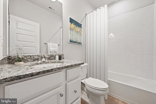 full bath with shower / bath combo with shower curtain, toilet, visible vents, and vanity