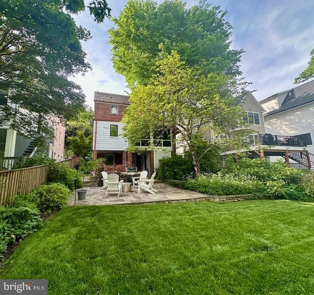 back of house with a patio