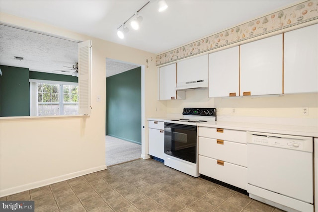 kitchen featuring baseboards, under cabinet range hood, light countertops, range with electric stovetop, and white dishwasher