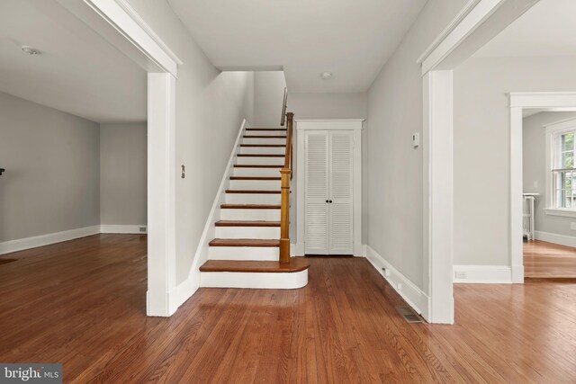 331 E Maple Rd, Linthicum Heights, MD 21090 - stairway with wood finished floors, baseboards, and radiator