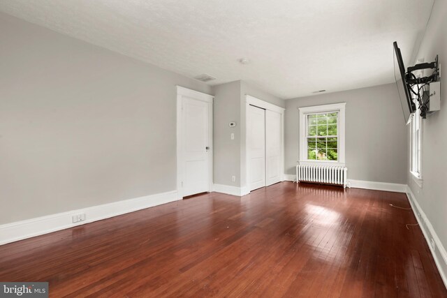 331 E Maple Rd, Linthicum Heights, MD 21090 - unfurnished room with radiator, hardwood / wood-style floors, and baseboards