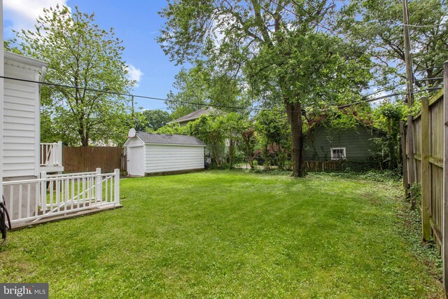 331 E Maple Rd, Linthicum Heights, MD 21090 - view of yard featuring a shed and an outbuilding