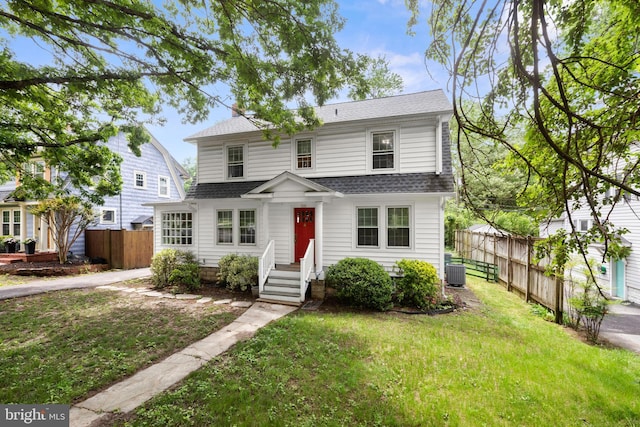 331 E Maple Rd, Linthicum Heights, MD 21090 - traditional-style home featuring roof with shingles and central AC unit
