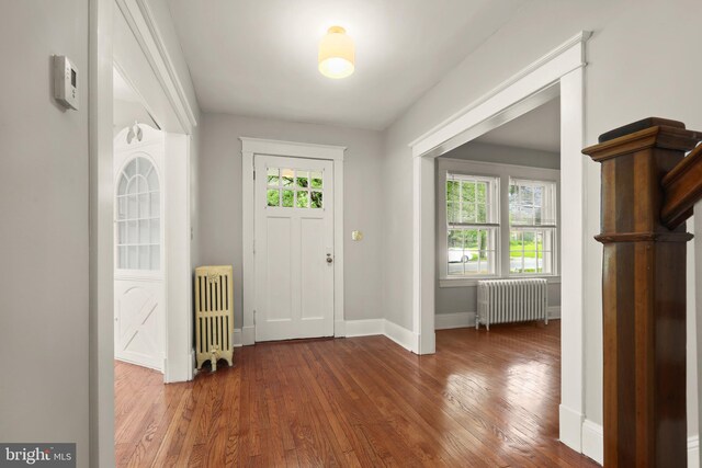 331 E Maple Rd, Linthicum Heights, MD 21090 - foyer entrance with radiator heating unit, hardwood / wood-style flooring, and baseboards