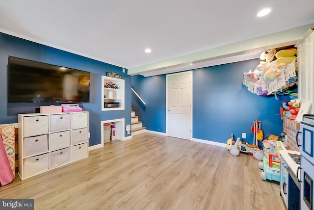 40 Robarts Dr, Phoenixville, PA 19460 - rec room with crown molding, wood finished floors, baseboards, and recessed lighting