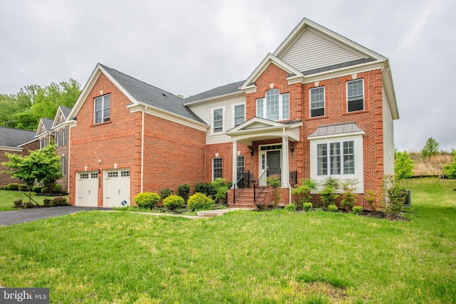 4902 Bridle Ridge Rd, Upper Marlboro, MD 20772 - traditional home with brick siding, a front lawn, an attached garage, and aphalt driveway