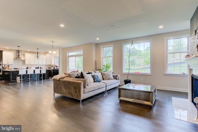 4902 Bridle Ridge Rd, Upper Marlboro, MD 20772 - living area with baseboards, a fireplace with flush hearth, recessed lighting, and dark wood-style floors
