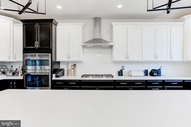 4902 Bridle Ridge Rd, Upper Marlboro, MD 20772 - kitchen featuring white cabinetry, light countertops, stainless steel appliances, and wall chimney exhaust hood
