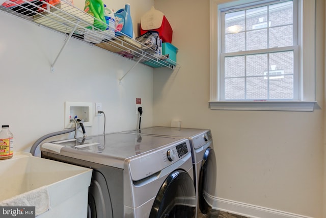 4902 Bridle Ridge Rd, Upper Marlboro, MD 20772 - laundry room featuring baseboards, a sink, laundry area, and independent washer and dryer