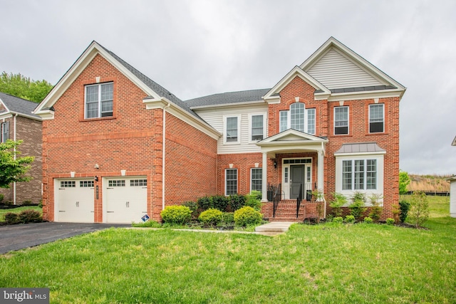 4902 Bridle Ridge Rd, Upper Marlboro, MD 20772 - traditional home featuring aphalt driveway, an attached garage, a front lawn, and brick siding