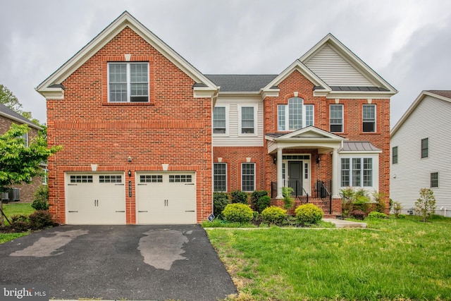 4902 Bridle Ridge Rd, Upper Marlboro, MD 20772 - view of front of property featuring brick siding, a garage, central air condition unit, aphalt driveway, and a front lawn