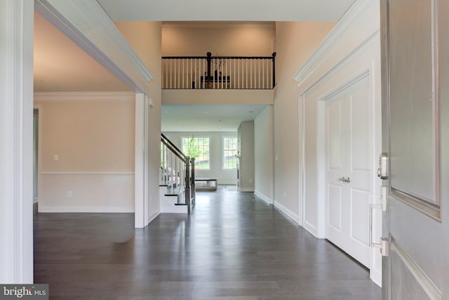 4902 Bridle Ridge Rd, Upper Marlboro, MD 20772 - entrance foyer featuring crown molding, wood finished floors, baseboards, and stairs