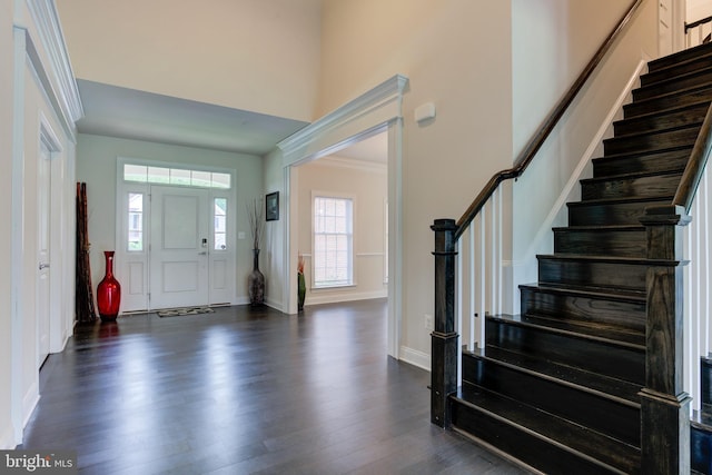 4902 Bridle Ridge Rd, Upper Marlboro, MD 20772 - foyer with baseboards, stairway, ornamental molding, and dark wood-type flooring