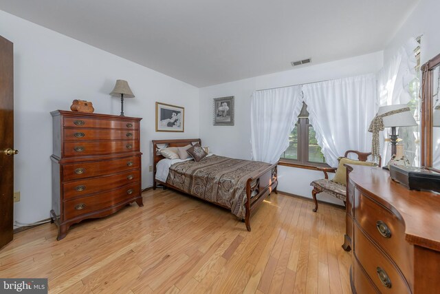 bedroom with light wood finished floors