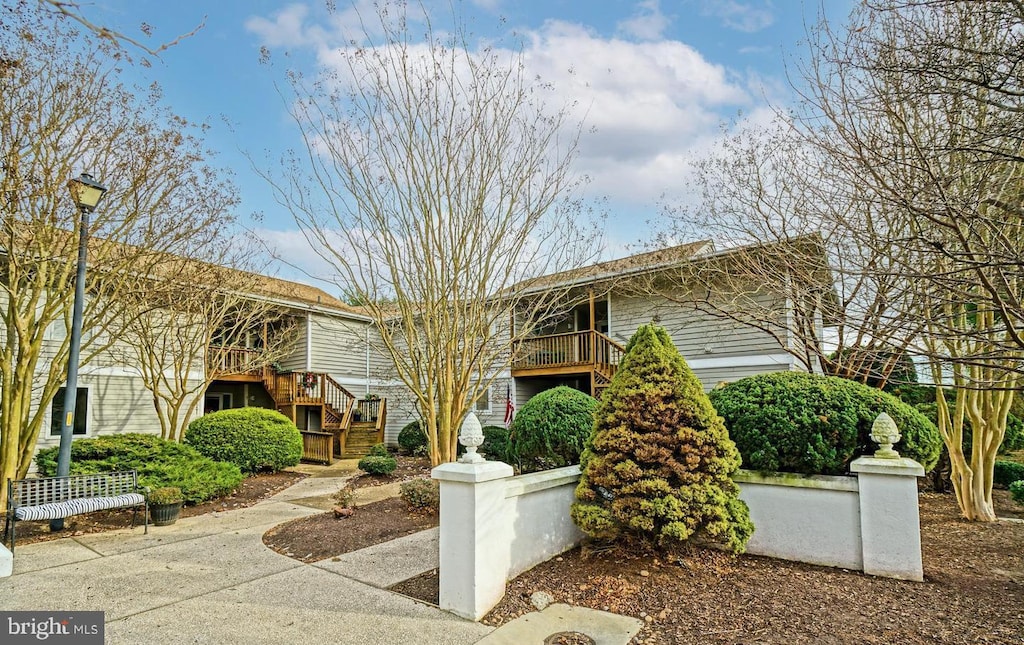 view of front of property with stairway