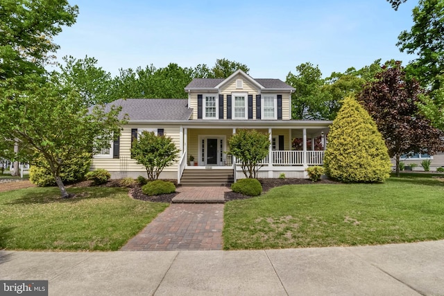 32469 Approach Way Unit 3296, Millsboro, DE 19966 - colonial inspired home with a front yard, a porch, and a shingled roof