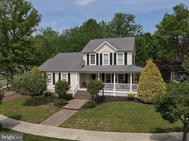 32469 Approach Way Unit 3296, Millsboro, DE 19966 - colonial-style house with a shingled roof, a porch, and a front yard