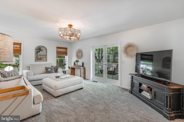 32469 Approach Way Unit 3296, Millsboro, DE 19966 - carpeted living room featuring a chandelier and visible vents