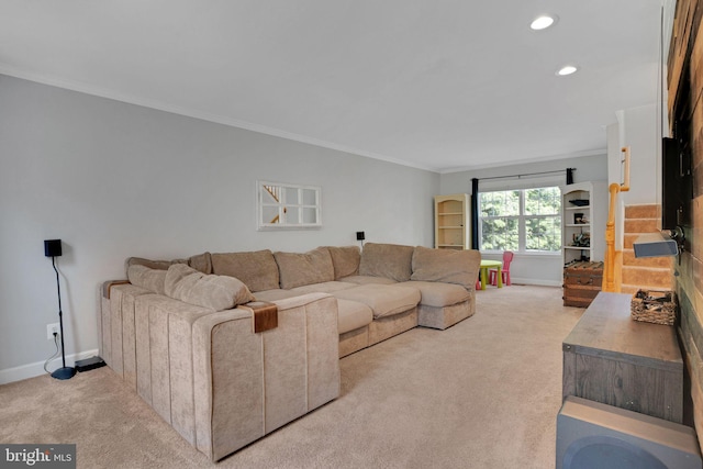 carpeted living room featuring baseboards, ornamental molding, and recessed lighting
