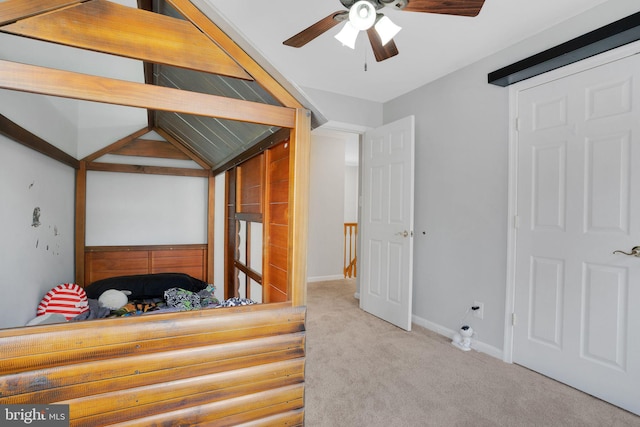 carpeted bedroom featuring baseboards and ceiling fan