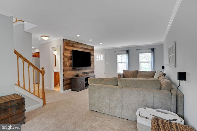 living room featuring recessed lighting, crown molding, light carpet, and stairs