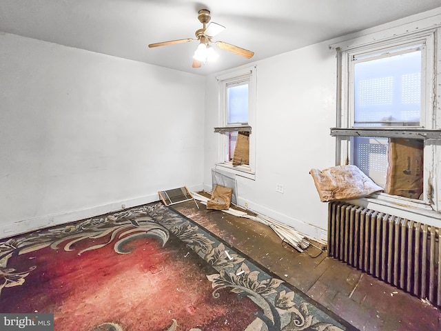 1837 W Juniata St, Philadelphia, PA 19140 - living area featuring radiator, plenty of natural light, ceiling fan, and wood finished floors