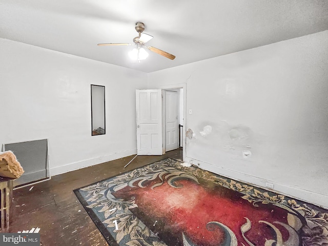 1837 W Juniata St, Philadelphia, PA 19140 - unfurnished bedroom featuring baseboards, concrete flooring, and a ceiling fan
