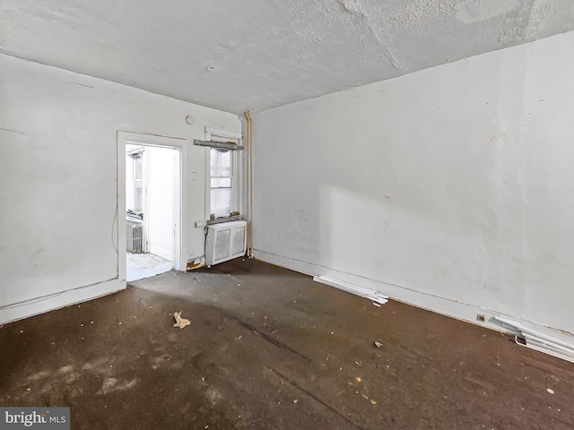 1837 W Juniata St, Philadelphia, PA 19140 - spare room featuring unfinished concrete floors and a textured ceiling