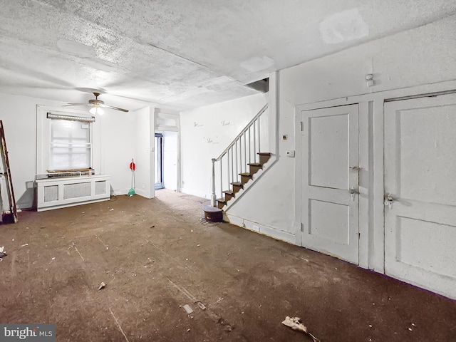 1837 W Juniata St, Philadelphia, PA 19140 - unfurnished living room with stairway and a ceiling fan