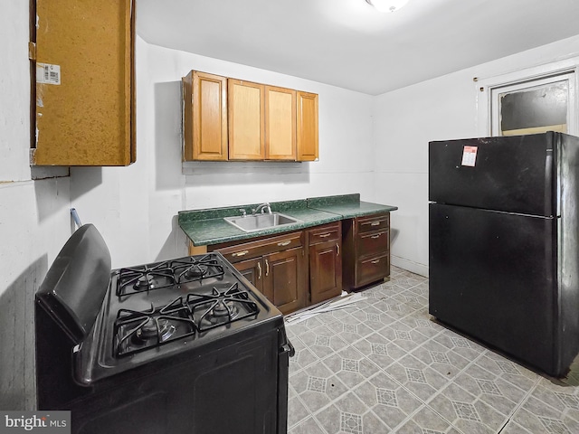 1837 W Juniata St, Philadelphia, PA 19140 - kitchen with black appliances, a sink, and dark countertops