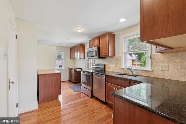 949 Laurance Ave, Elkins Park, PA 19027 - kitchen featuring appliances with stainless steel finishes, brown cabinets, a sink, and healthy amount of natural light