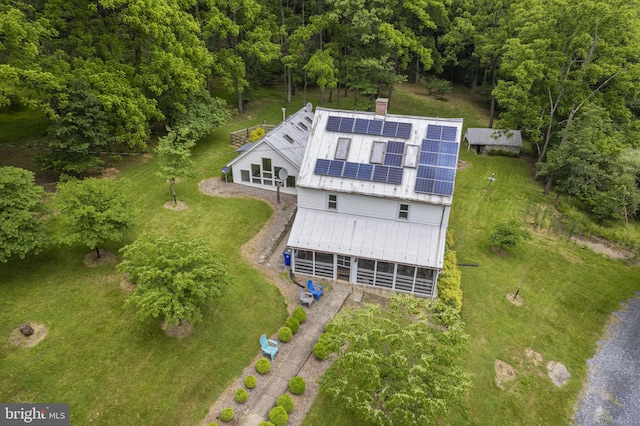 bird's eye view featuring a wooded view