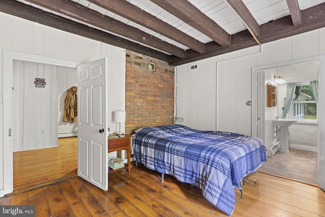 bedroom featuring beamed ceiling, a baseboard radiator, visible vents, and wood-type flooring