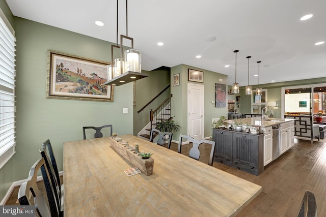 dining space with stairway, dark wood-style floors, recessed lighting, and baseboards